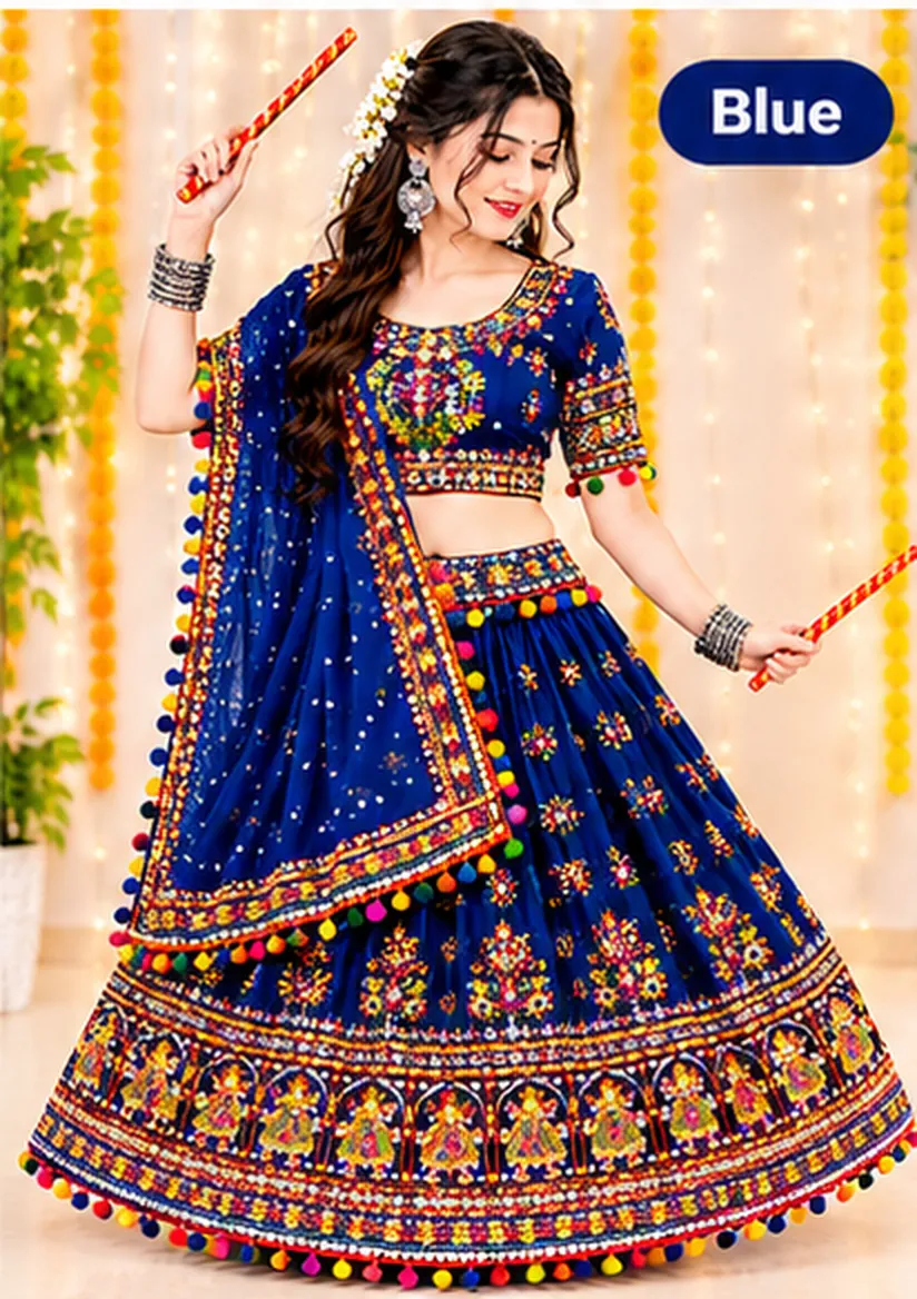 Woman dancing with dandiya sticks in a royal blue chaniya choli with mirror work, pom-pom trim and a matching dupatta