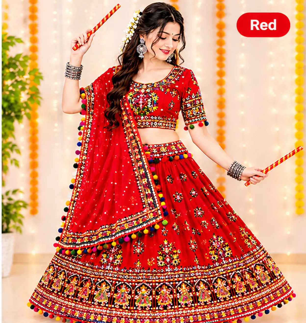 Woman dancing with dandiya sticks in a red chaniya choli with mirror work, pom-pom trim and a matching dupatta